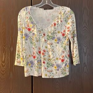 Hazel 3/4 sleeved white top with multi-colored floral pattern. Size Small